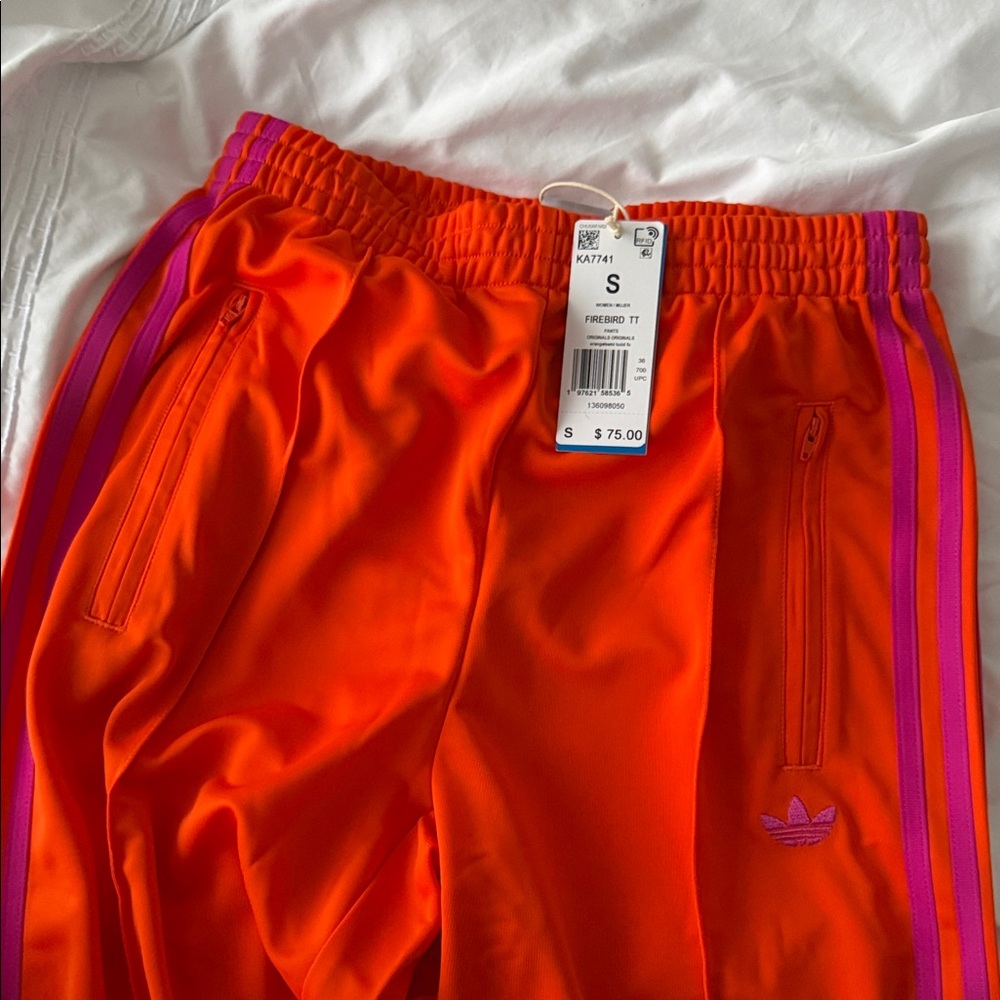 Adidas women’s Vibrant Orange Joggers with Purple Stripes